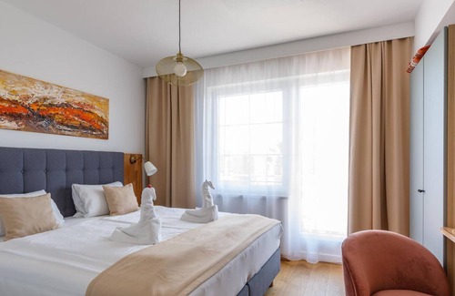 Morbisch am See Cottage | Doppelzimmer mit Boxspringbett Hofseite - Pension Laubenhof