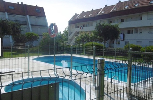 Santiuste Condo | Duplex near the beach with pool and surfer essence in gated community