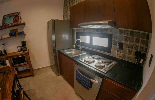 Mario Villanueva Madrid Condo | Elegant 1-Bedroom Retreat w/Rooftop Oasis & Pool