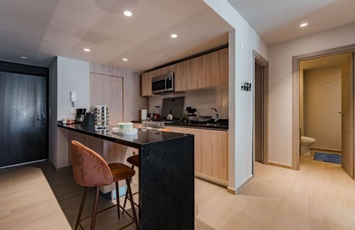 Del Valle Apartment | Elegant Apartment with Balcony and City Views