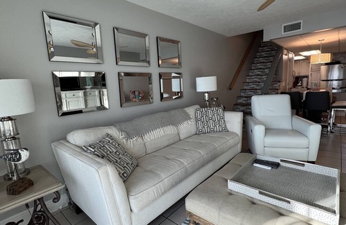 Sunnyside House | Enjoy inside and out! One step to sand and back to a shower tower or a Jacuzzi