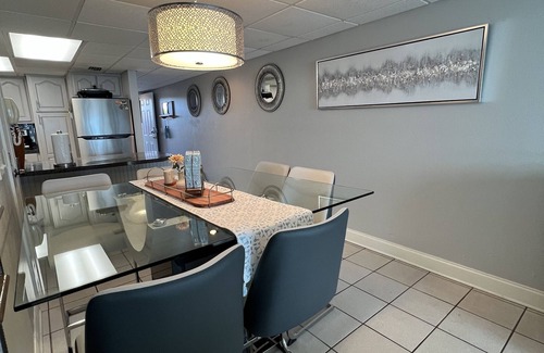 Sunnyside House | Enjoy inside and out! One step to sand and back to a shower tower or a Jacuzzi