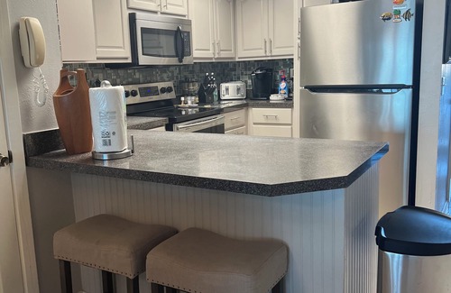 Sunnyside House | Enjoy inside and out! One step to sand and back to a shower tower or a Jacuzzi