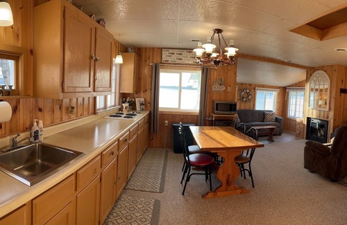 Lewiston Cabin | Escape to the Holiday House. Serenity of Sunsets, Lakeside boat dock included.