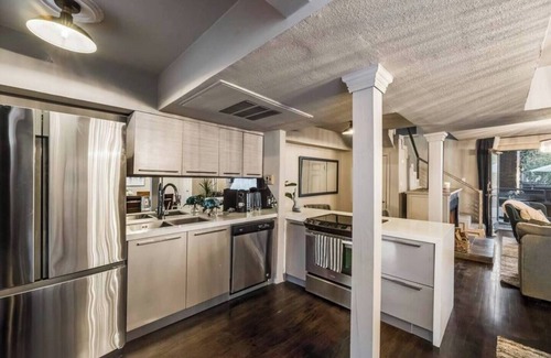 Lower Greenville Condo | Expansive 2-bed loft with fireplace, full kitchen, smart TVs, and access to an award-winning courtyard & resort pool.