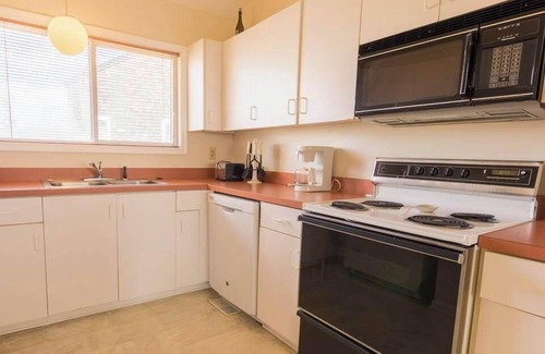 Ocean Sands House | Experience coastal charm at 1838 - Paradise Suite, a spacious 2-bedroom condo in Corolla, NC