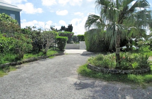 Sandys Apartment | Fabulous ocean view, private pool and garden, ideal location.