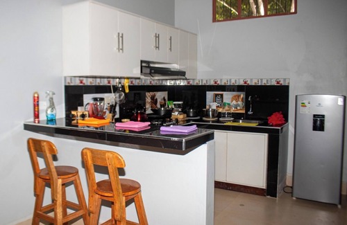 Sauce House | Family vacation home with a view of the forest and access to a small river.