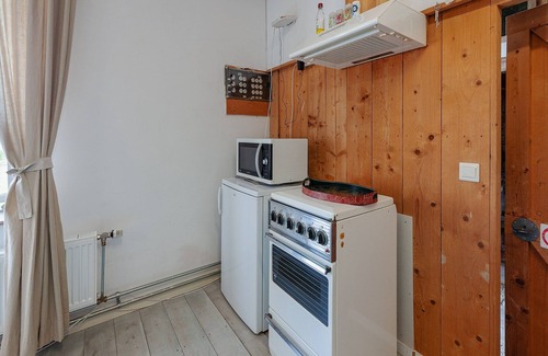 Burum Apartment | Farmhouse by Lauwers River with Rowing Boat