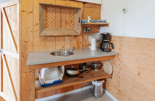 Burum Apartment | Farmhouse by Lauwers River with Rowing Boat