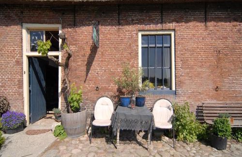 Burum Apartment | Farmhouse by Lauwers River with Rowing Boat
