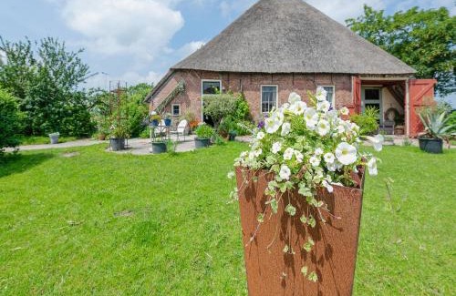 Burum Apartment | Farmhouse by Lauwers River with Rowing Boat