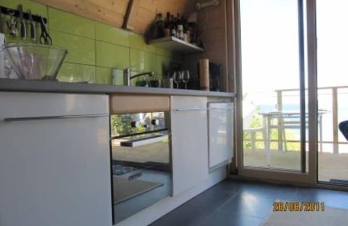Locquirec House | Feet in the water, wooden house with terrace, breathtaking sea view.