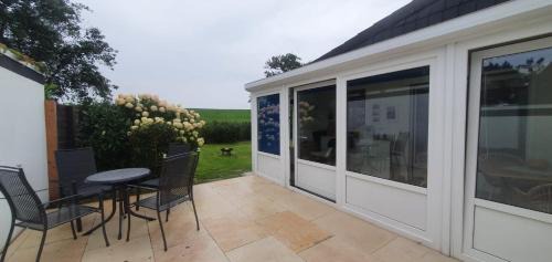 Neufeld House | Ferienhaus Frische Brise direkt am Nordsee Deich