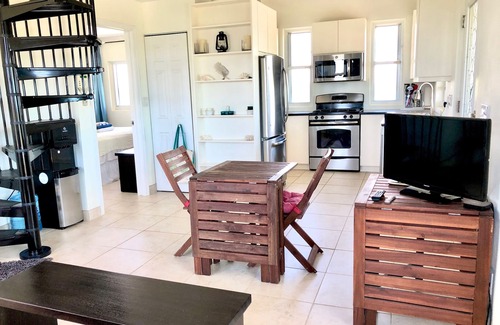 Long Bay Cottage | Flame Tree Cottage. Private home with pool and ocean view. 1/2 mile to beach