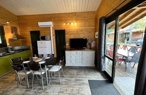 Leval Ski Chalet | Flower Camping du Lac de la Seigneurie * - Chalet Savania PREMIUM46 34 m2 (2 bedrooms) + covered terrace of 13 m2 + TV + reversible air conditioning 6 people