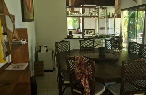 Guaiu House | Flower house on the edge of Guaiú beach in a high-standard condominium.
