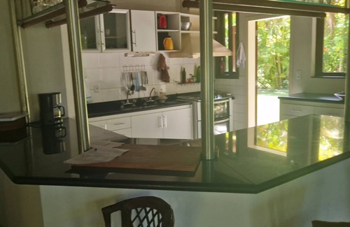 Guaiu House | Flower house on the edge of Guaiú beach in a high-standard condominium.