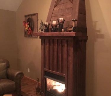 Spencer House | Gas fireplace, firepit, and cedar Adirondack chair