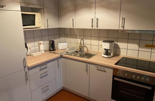Zandt Apartment | Gemütliches Ferienhaus mit Holzsauna, Holzkaminofen und Garten
