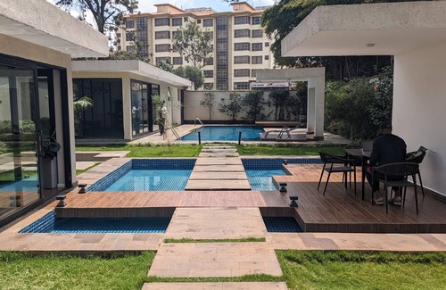 Riruta Condo | Gorgeous top floor condo with pool