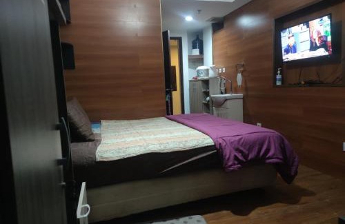 Bekasi Timur Apartment | Grand Dhika Apartement by 2325 Studio room with cozy wooden style room