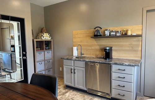 Sugarcreek Apartment | Great bedroom with private bathroom & Lounge above a local Diner