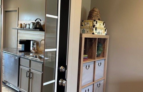 Sugarcreek Apartment | Great bedroom with private bathroom & Lounge above a local Diner