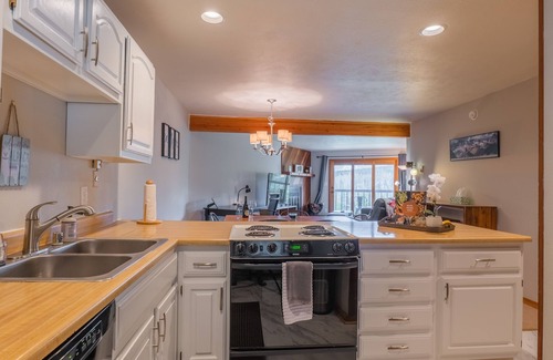 Wildernest Condo | Great views, cozy feel, central to outdoor activities, and relaxing hot tub/pool