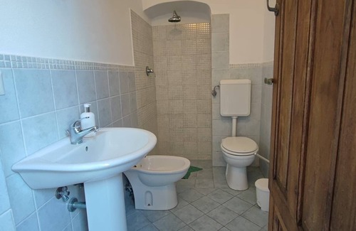 Stromboli Villa | Green room with 4 beds, bathroom and patio with equipped kitchen
