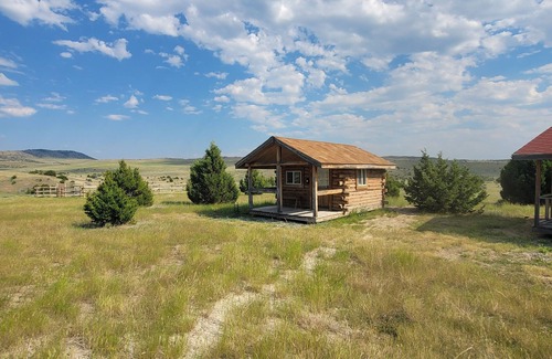 Manhattan Cabin | GRIZZLY ROCK RANCH Rustic Tiny Log Cabin Glamping and Horseback Riding Available