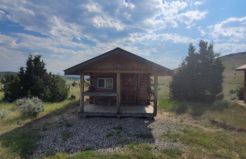 Manhattan Cabin | GRIZZLY ROCK RANCH Rustic Tiny Log Cabin Glamping and Horseback Riding Available