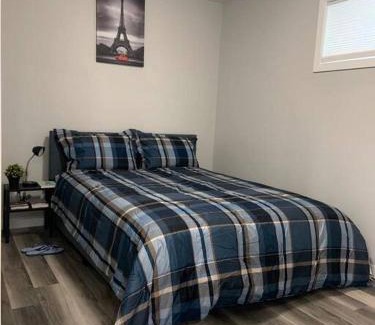 Regina Apartment | Guest Suite in Regina - Queen Bed