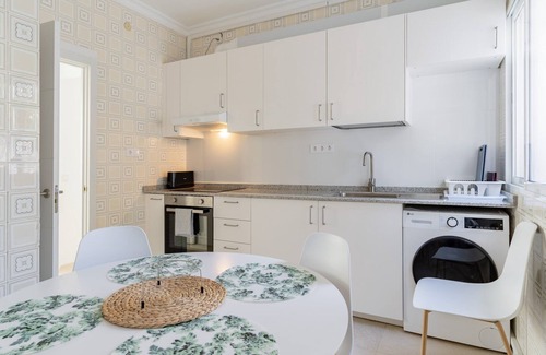 Playas del Palo Apartment | GuestReady - Terrace Malaga view