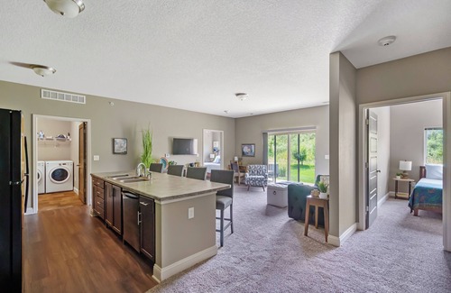 West Des Moines Apartment | Halcyon Hale Harmonized Hospitality Ground Floor Scenic End Unit Garage/Pool/Gym