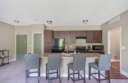West Des Moines Apartment | Halcyon Hale Harmonized Hospitality Ground Floor Scenic End Unit Garage/Pool/Gym