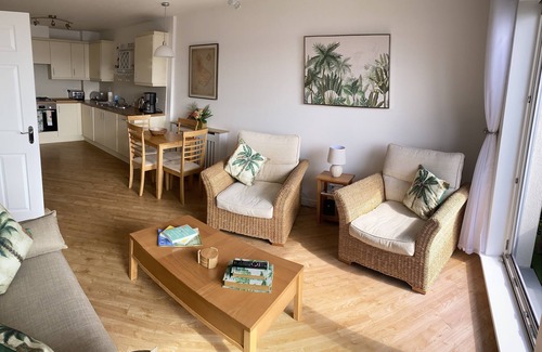 Hamworthy Apartment | Harbour Lights sea and beach views with a Caribbean-style and secure parking