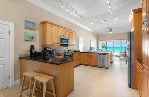 Rokers Point House | Hart House, vast patio with hot tub, heated pool & outdoor bar on Flamingo Bay