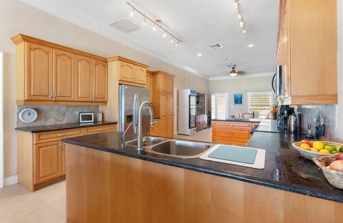 Rokers Point House | Hart House, vast patio with hot tub, heated pool & outdoor bar on Flamingo Bay