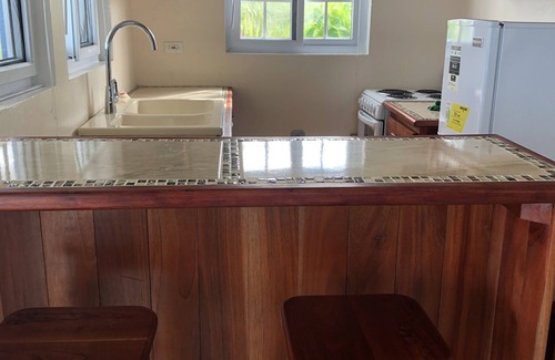 Lucea Apartment | Hilltop Studio with ocean views, free daily breakfast and airport pickup.