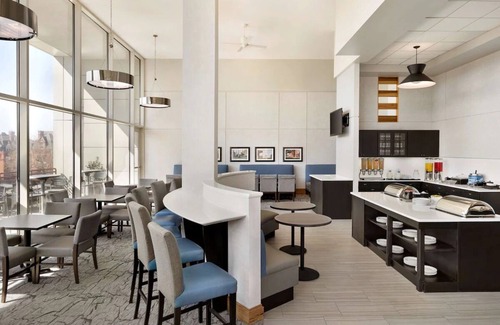 Spruce Hill Hotel | Historic Philly: Stylish Suites with Full Kitchens, Pool Access & Free Parking!