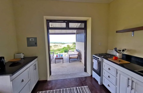 Gibbs Bay Apartment | Historic sea view 1 bed apartment in restored stone house