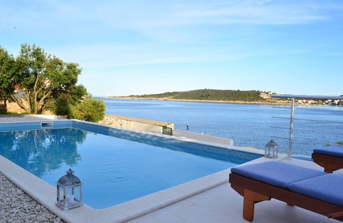 Sevid House | Holiday beach house with private heated pool and buoy