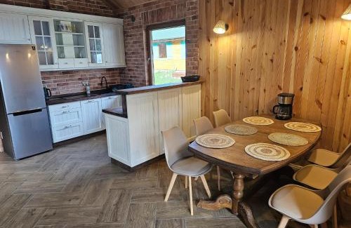 Szczecinek House | Holiday Home by Lake Wierzchowo with Boats