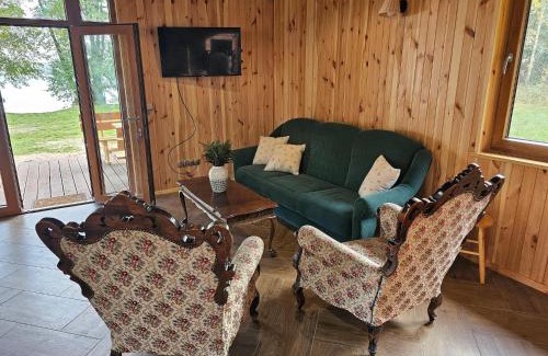 Szczecinek House | Holiday Home by Lake Wierzchowo with Boats