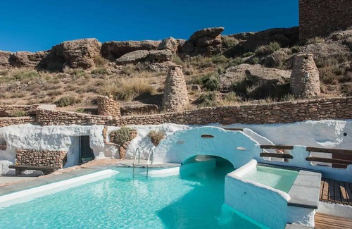 Los Balcones House | Holiday Home 'Cueva Balcones de Piedad - Granado' with Terrace, Shared Pool & Wi-Fi