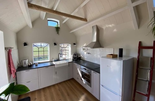 Huns House | Holiday home for 6 people in a Frisian village with a spacious kitchen diner