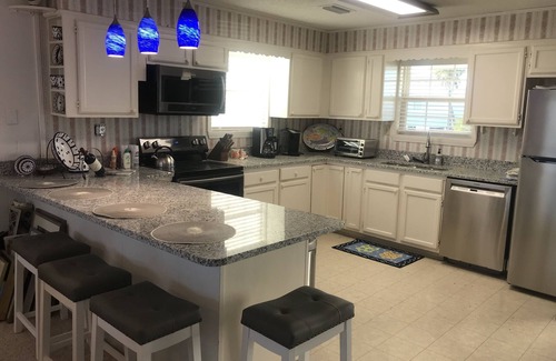 Silver Cay House | Home on water w/boat dock. 3 bed, 3 bath. Sleeps 9. Sunsets, beaches, fishing.
