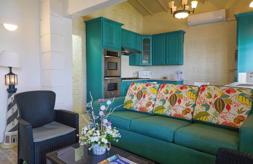 Koyari Apartment | Homey 2-bdrm Apartment with Pool and Garden, 5 min to Eagle Beach and Palm Beach