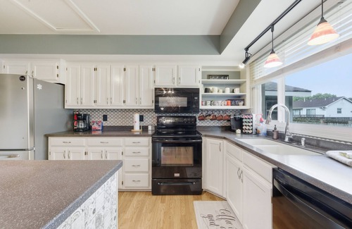 Wichita House | Hot Tub - Pool Table - Fire Pit - Family Friendly! Hosted by Homes by CNJ.